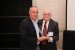 Dr. Nagib Callaos, General Chair, giving Eng. Joseph Prezzama a award "In Appreciation for Delivering a Great Keynote Address at a Plenary Session."